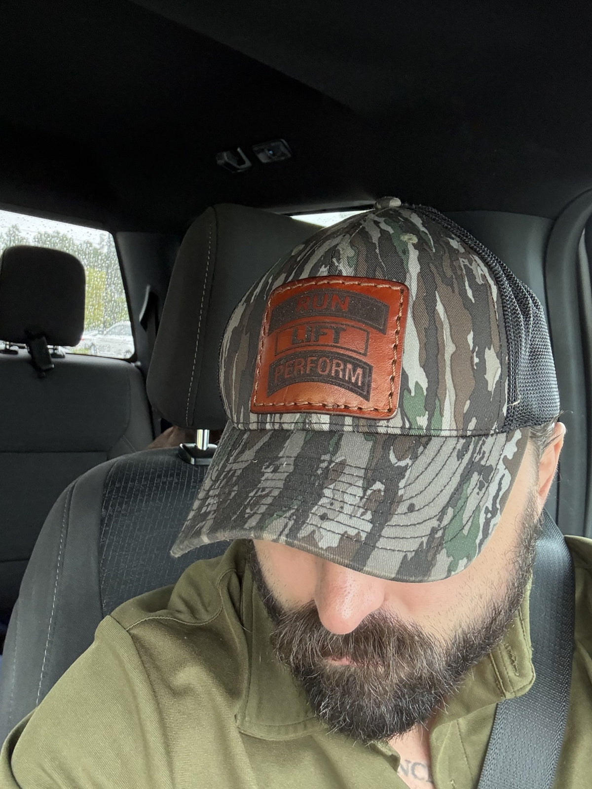 Run Lift Perform tab patch trucker hat in Realtree Original camo with black mesh back